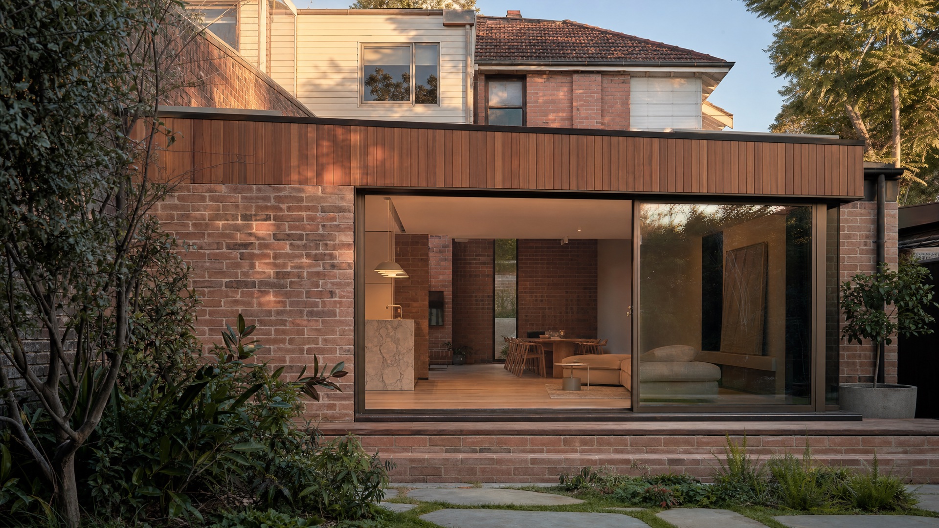 Modern rear home extension opening to a leafy garden — illustrative concept