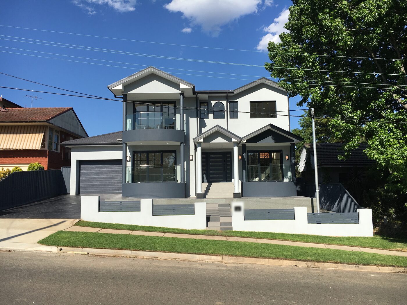 After — The original single-storey brick home before, and the completed two-storey rebuild after