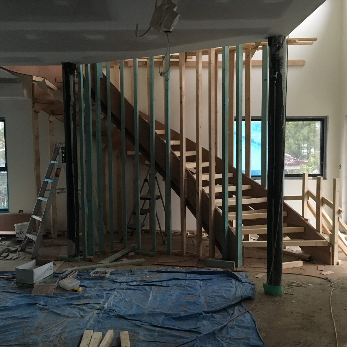 During the build — the new staircase and upper floor framed out