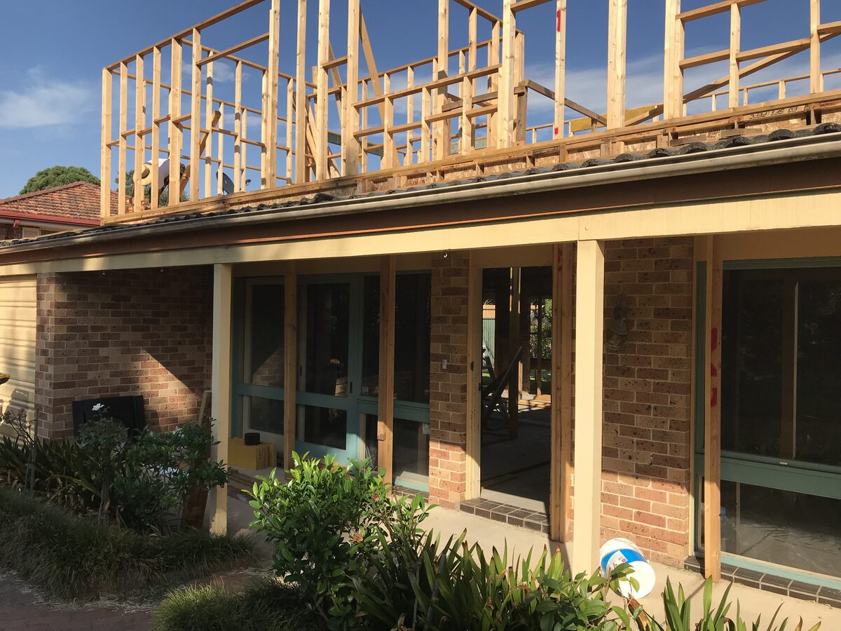 During the build — the new upper-floor walls framed over the ground floor