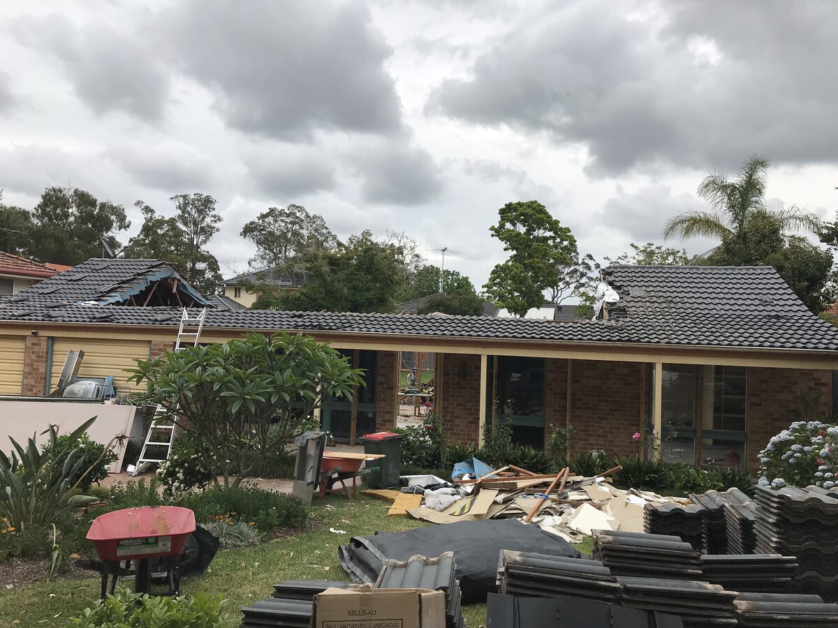 During the build — the original roof removed to start the upper floor