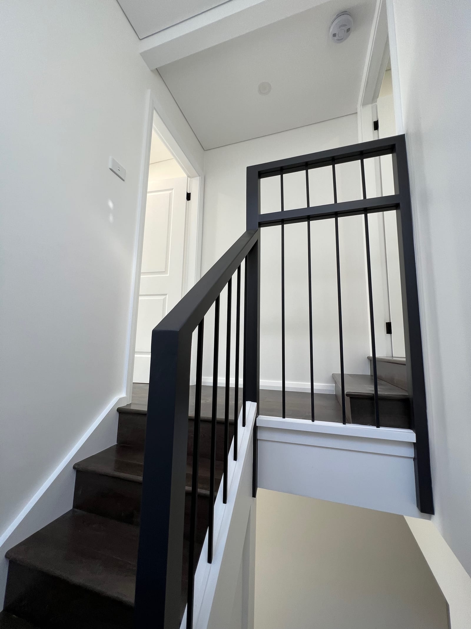 During construction — the new internal staircase with a black metal balustrade