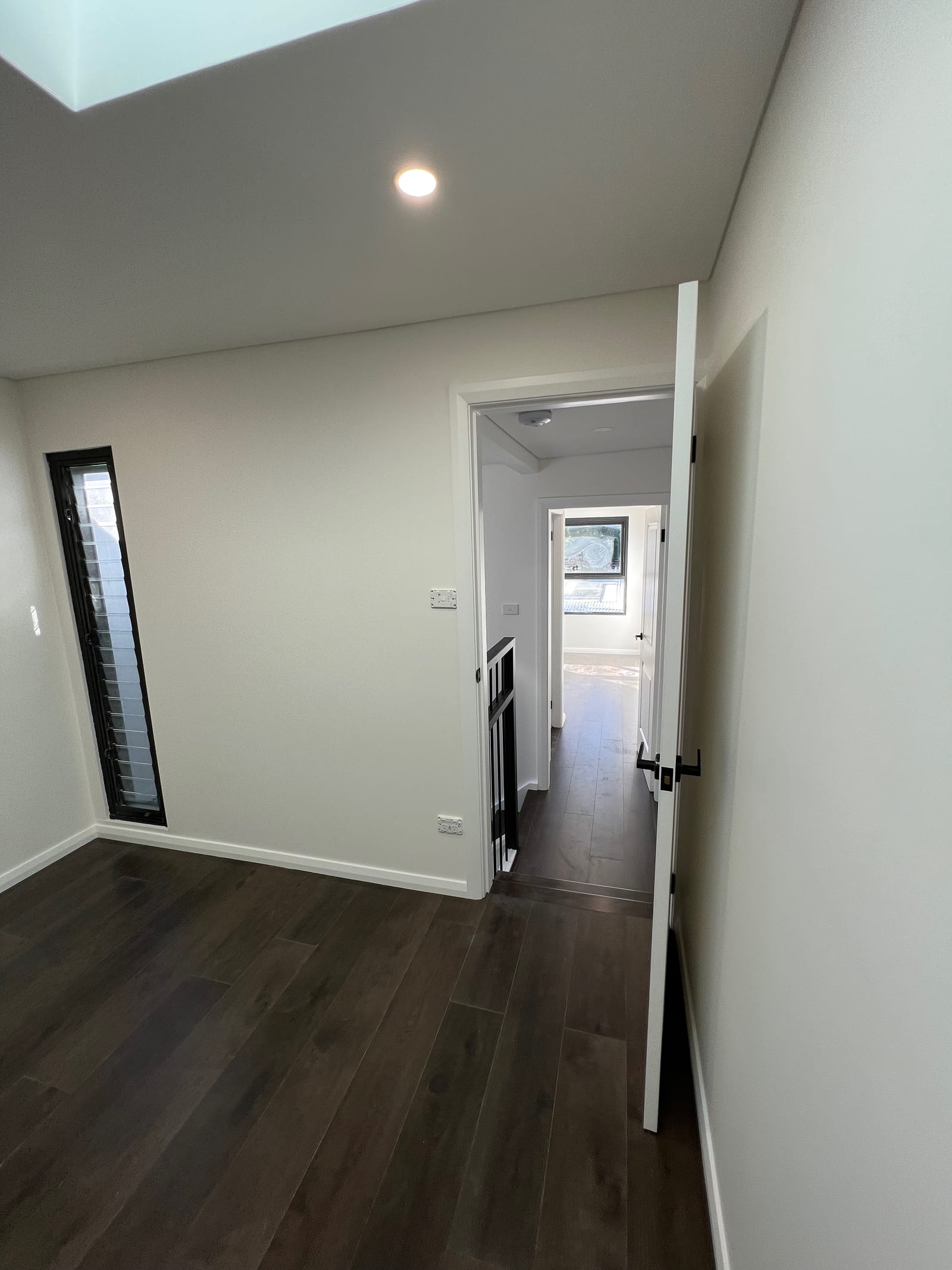 During construction — the unfurnished upstairs hallway and stairwell