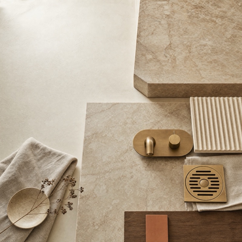 Material selections — honed stone, aged oak veneer, aged brass tapware