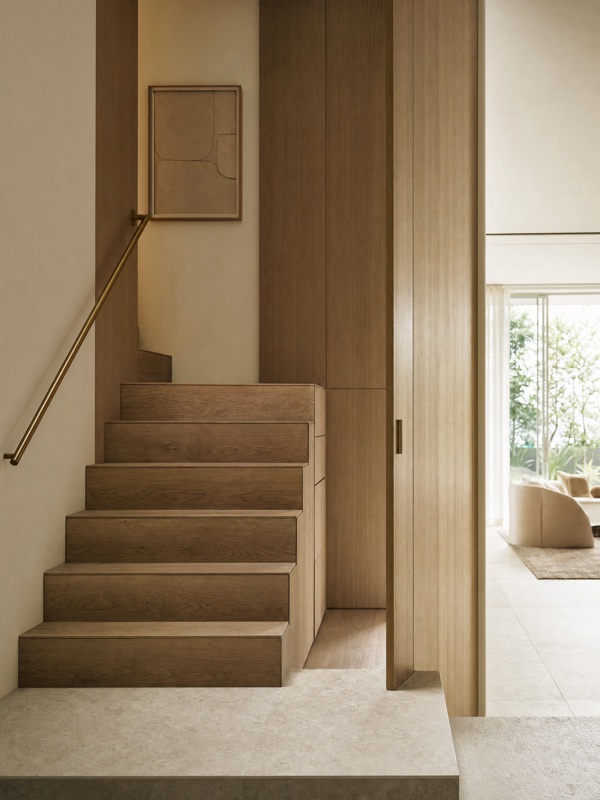 Custom oak staircase and joinery with a brushed-brass handrail — Panadium detail work